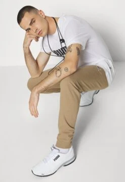 Puma Better Essentials - Tracksuit Bottoms - Toasted -Winter Menswear Store 49de20d33f4c4c11a62fd5ce88940a4e scaled